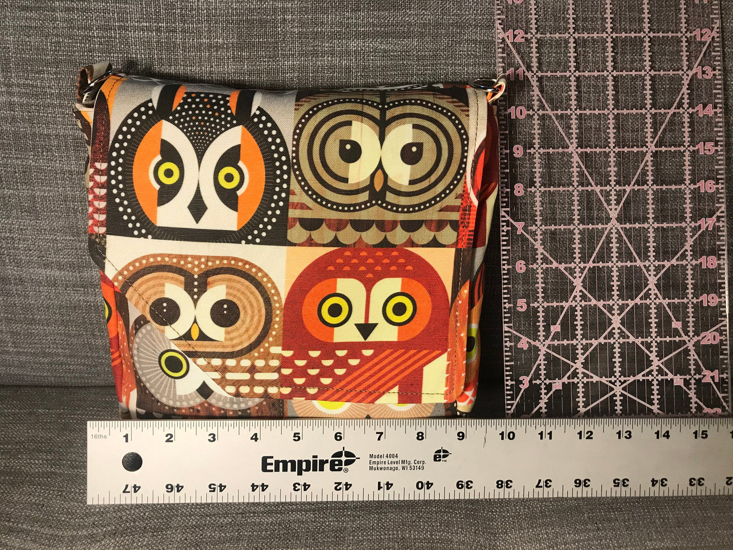 Owl print bag made of artisan fabric and hand waxed canvas! Adjustable strap, five pockets & roomy interior, magnetic flap closure.