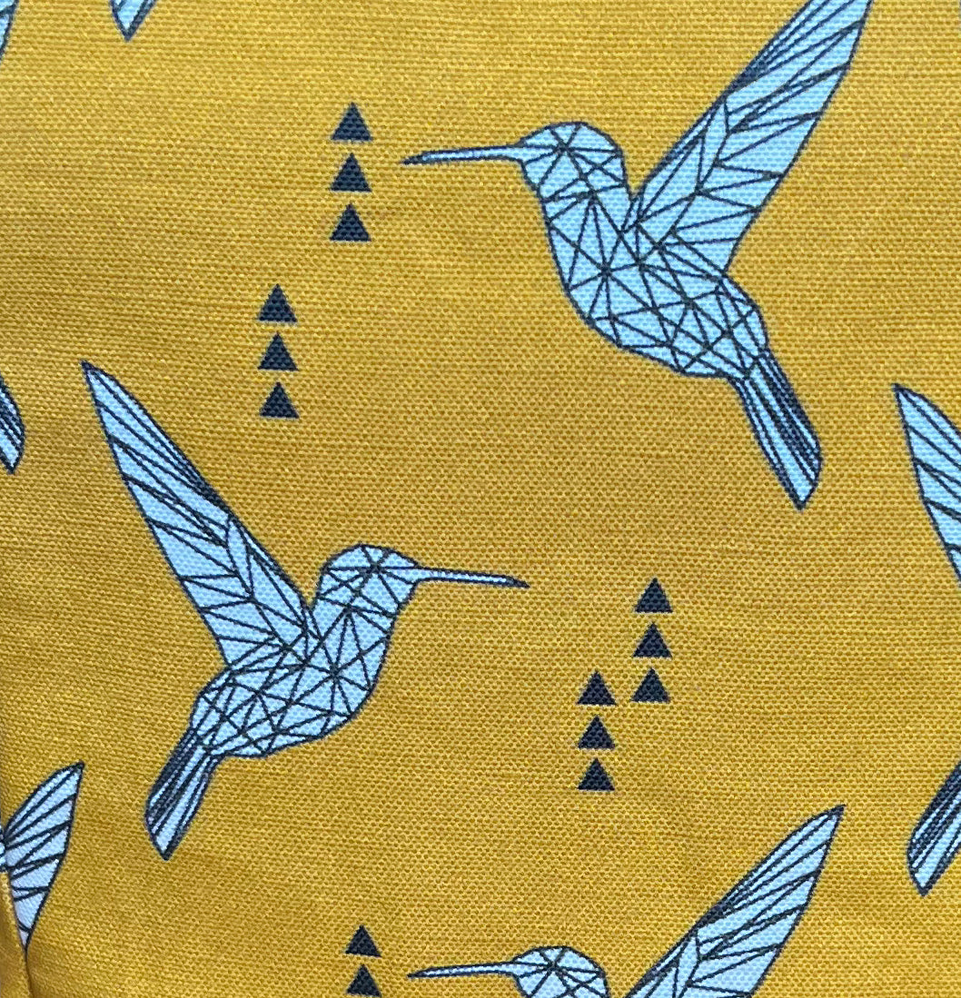 Zoomed in yellow fabric with geometric pattern