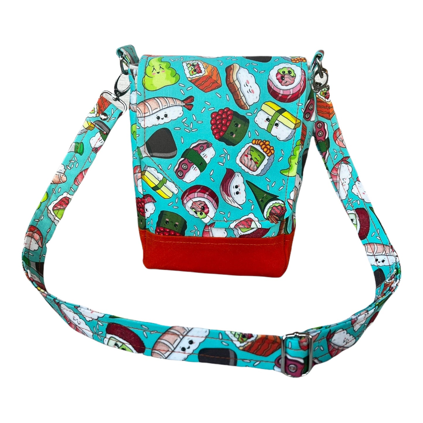 Kawaii sushi crossbody bag built for a day on the town! It has an adjustable strap, two pockets, main compartment and magnetic closure.