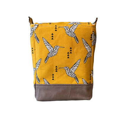 Back of yellow purse with bird