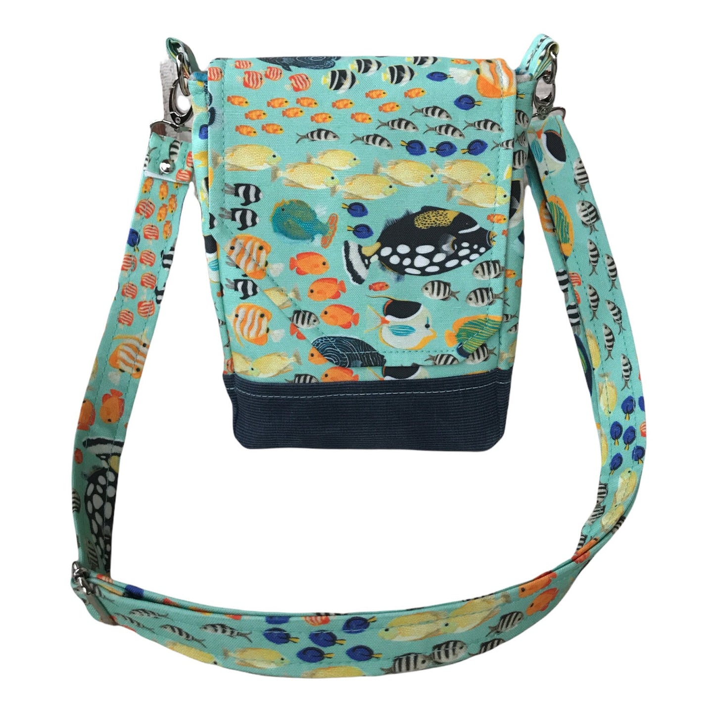 Tropical fish crossbody purse, linen body with waxed canvas base. It has an adjustable strap, two pockets + magnetic closure.